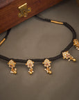 ANTIQUE BLOOMS BLACK THREAD NECKLACE