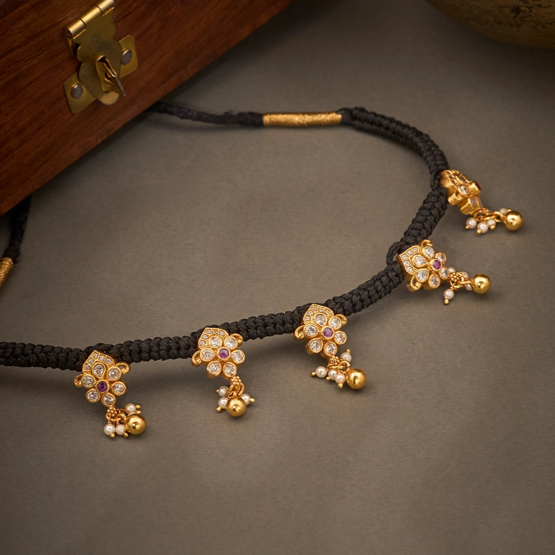 ANTIQUE BLOOMS BLACK THREAD NECKLACE